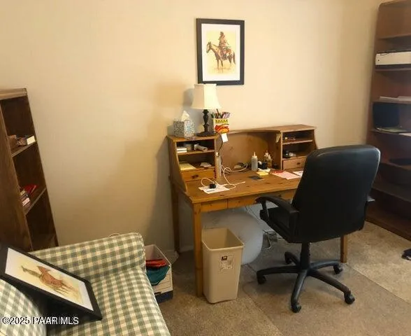 a work room with furniture and a window