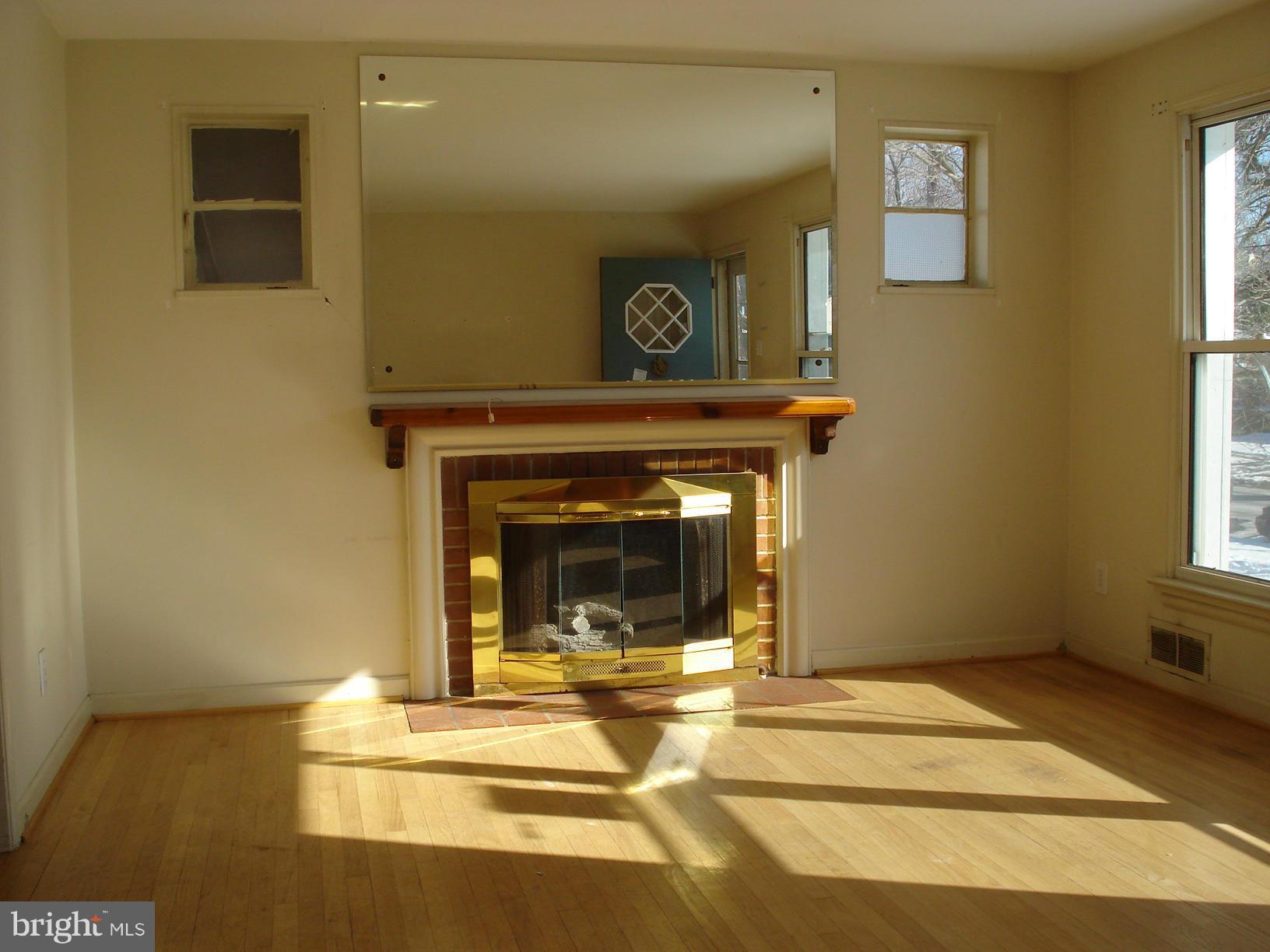 3525 Harrell Street Silver Spring, MD 20906 - Photo 2 of 24 a view of a livingroom with a fireplace and window