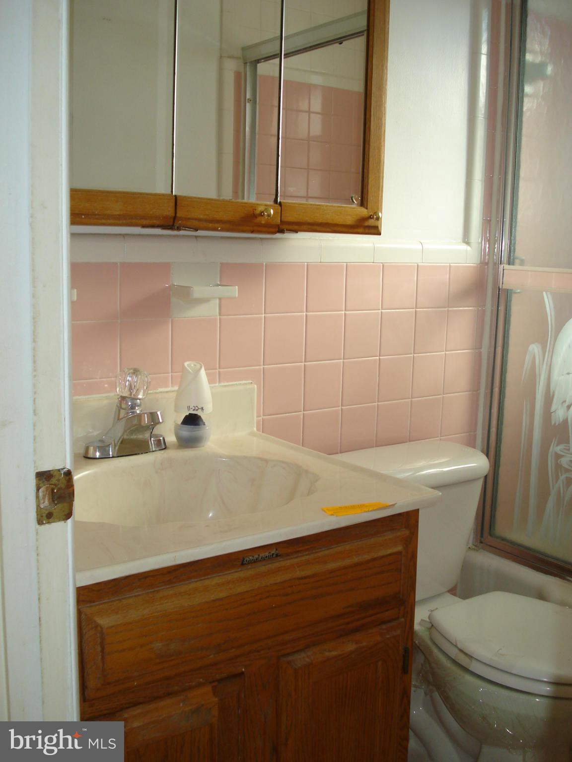 3525 Harrell Street Silver Spring, MD 20906 - Photo 11 of 24 a bathroom with a sink a toilet and shower