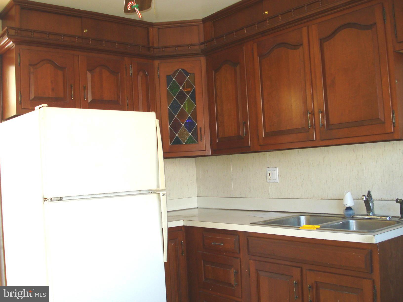 3525 Harrell Street Silver Spring, MD 20906 - Photo 13 of 24 a kitchen with a sink and cabinets