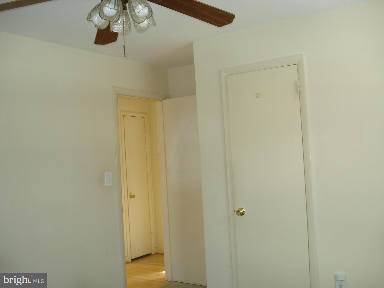 3525 Harrell Street Silver Spring, MD 20906 - Photo 7 of 24 a view of a hallway with a chandelier fan