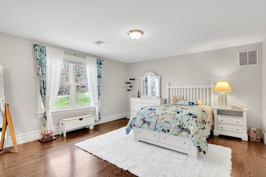 311 Concord Avenue Lexington, MA 02421 - Photo 17 of 28 a bedroom with a bed and a window