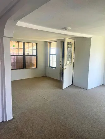 an empty room with windows