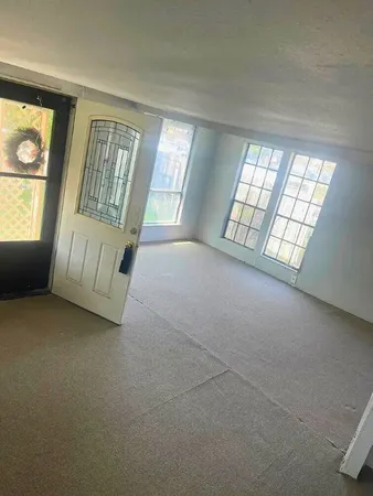 an empty room with windows