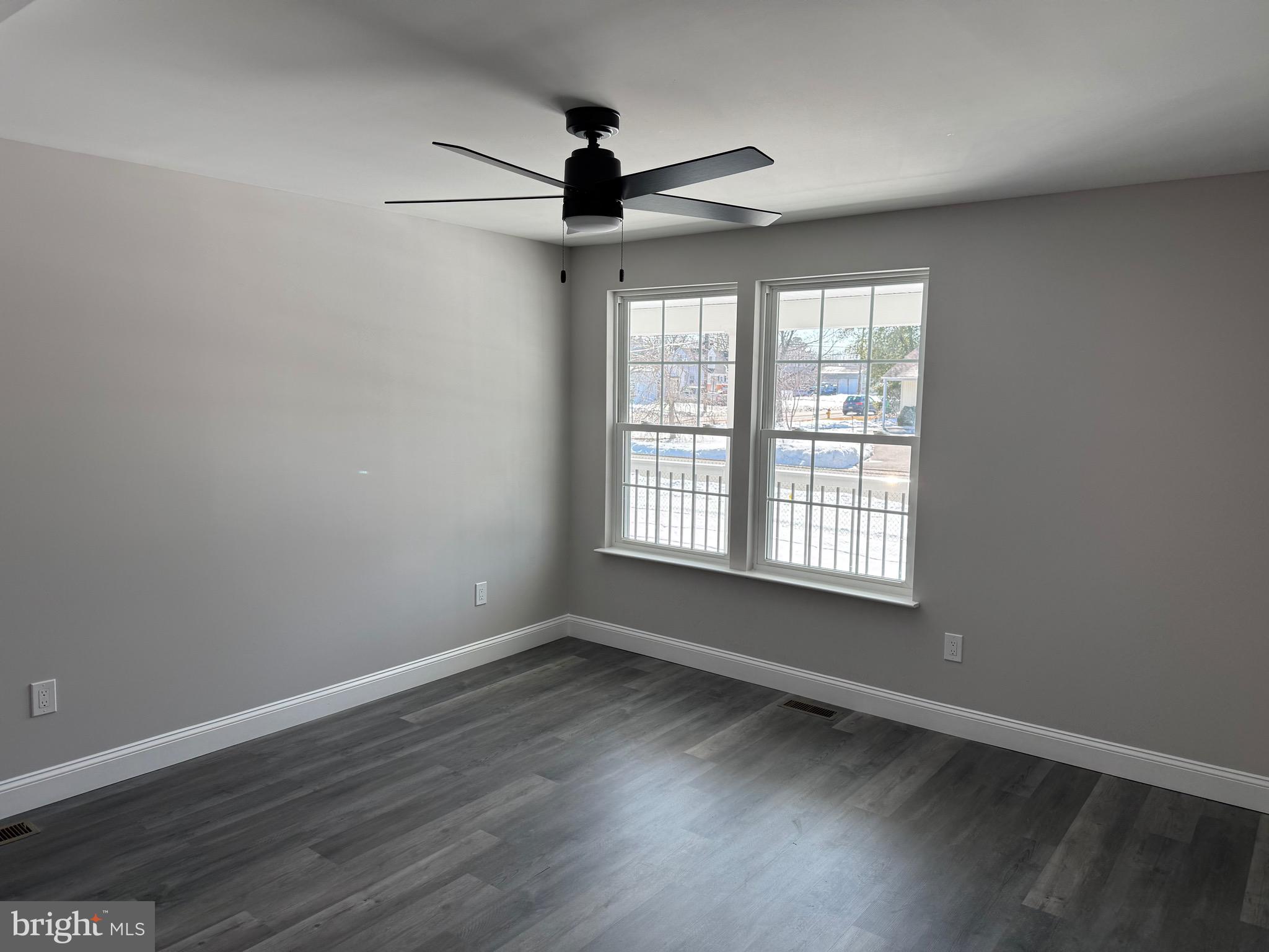 204 3rd Avenue West Berlin, NJ 08091 - Photo 13 of 19 a view of an empty room with wooden floor and a window