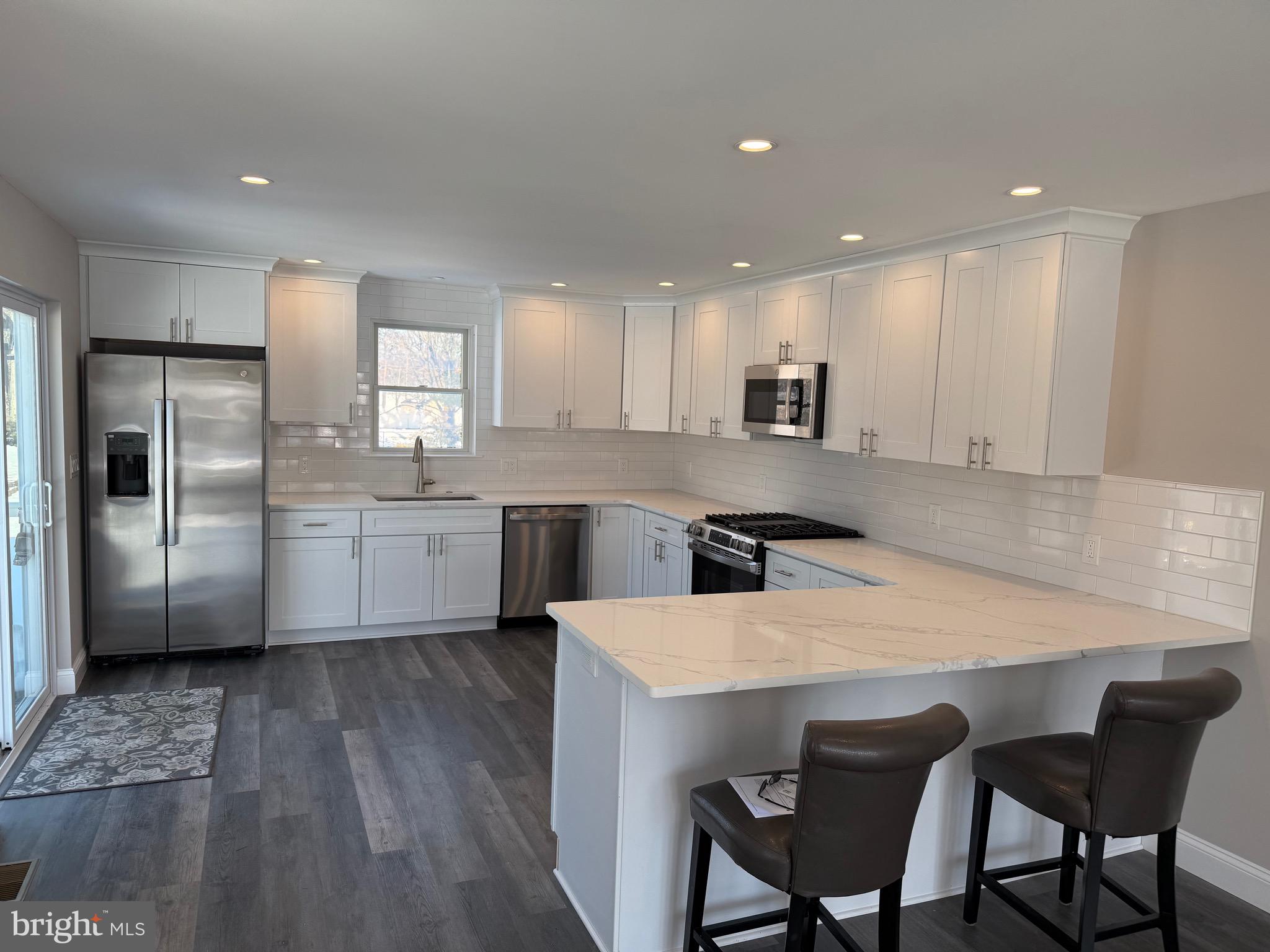 204 3rd Avenue West Berlin, NJ 08091 - Photo 2 of 19 a large kitchen with a table and chairs