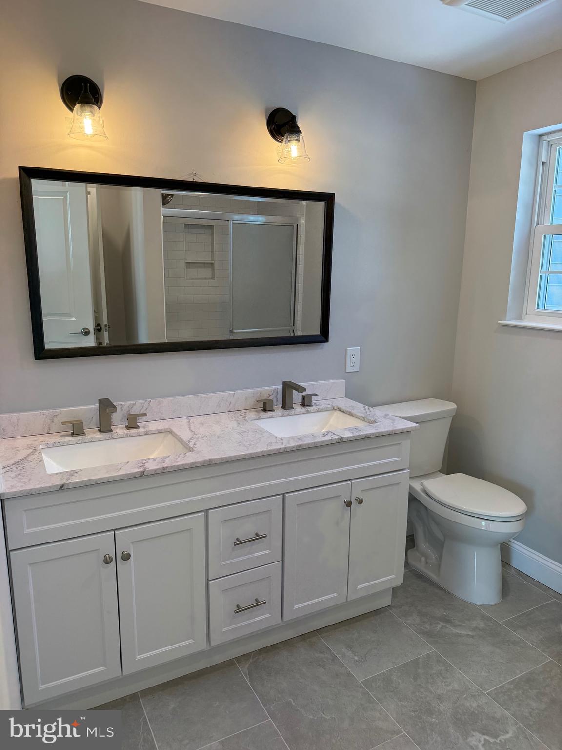 204 3rd Avenue West Berlin, NJ 08091 - Photo 5 of 19 a bathroom with a toilet sink and mirror