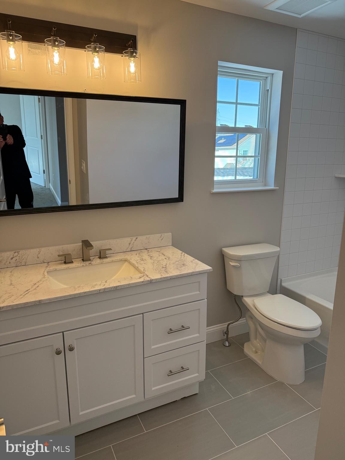 204 3rd Avenue West Berlin, NJ 08091 - Photo 8 of 19 a bathroom with a granite countertop toilet sink and mirror