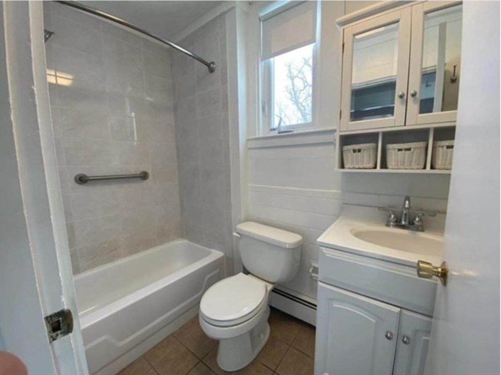 90 Massasoit Street, Unit 90 Waltham, MA 02453 - Photo 15 of 15 a bathroom with a sink toilet and shower