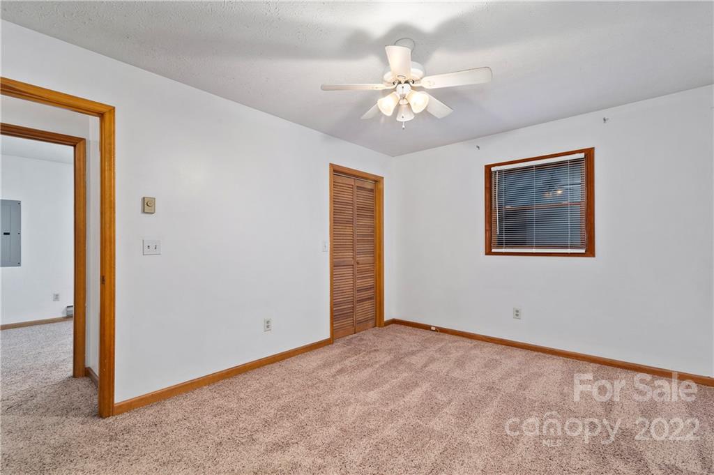 400 Stoney Ridge Loop Maggie Valley, NC 28751 - Photo 11 of 15 a view of an empty room with chandelier fan