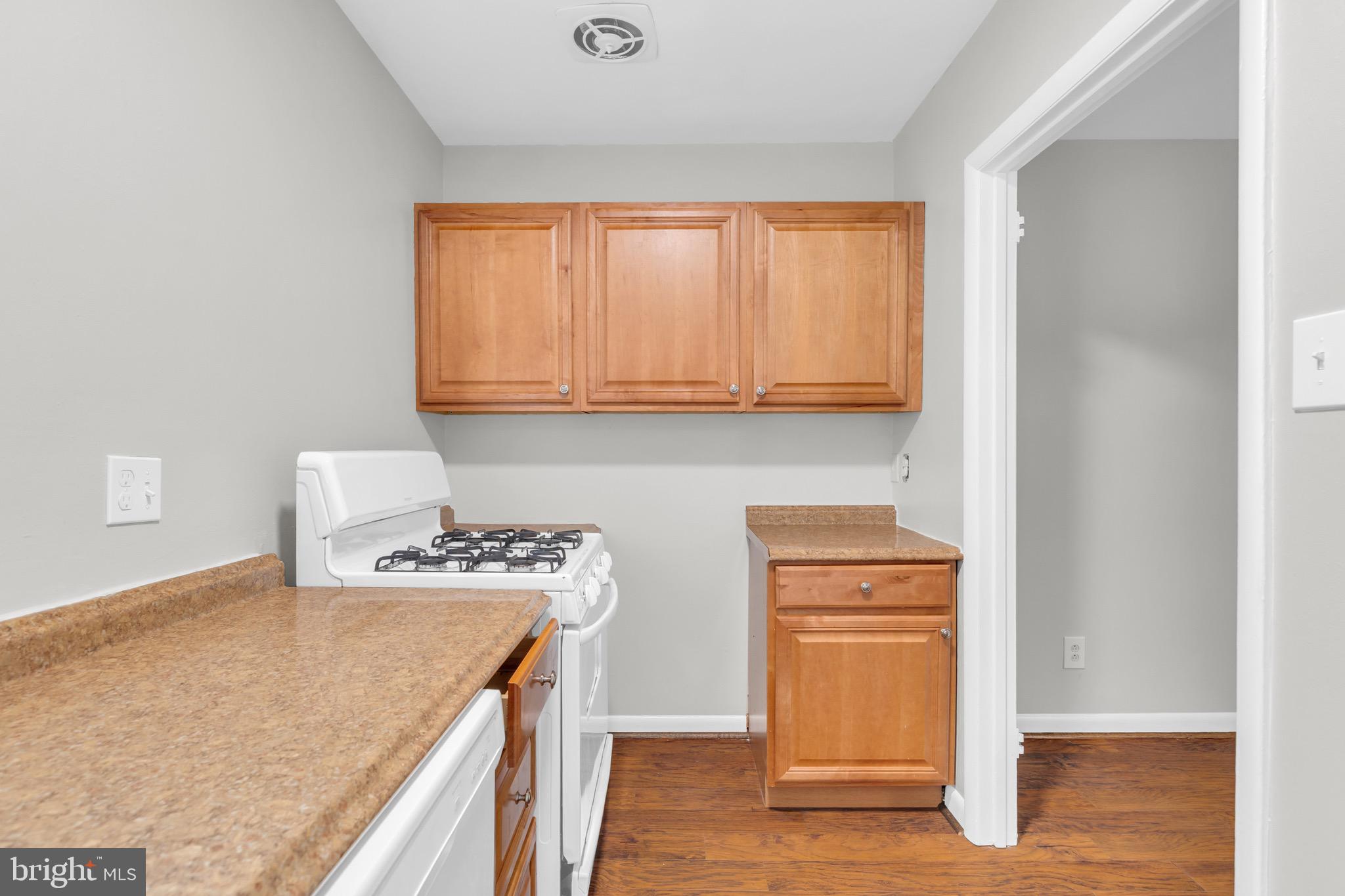 11620 Vantage Hill Road, Unit 22B Reston, VA 20190 - Photo 14 of 24 a kitchen with stainless steel appliances granite countertop a stove and a microwave