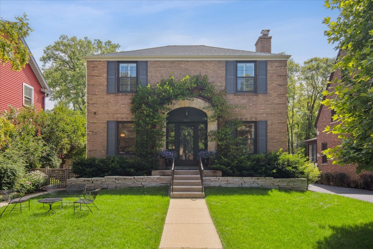 2429 Prospect Avenue Evanston, IL 60201 - Photo 2 of 31 a front view of a house with a yard