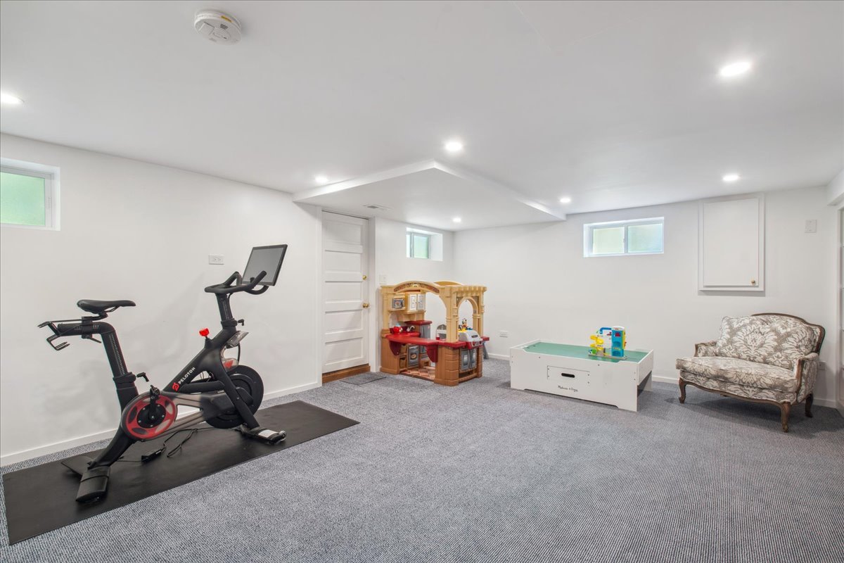 2429 Prospect Avenue Evanston, IL 60201 - Photo 22 of 31 a bedroom with furniture and a gym equipment