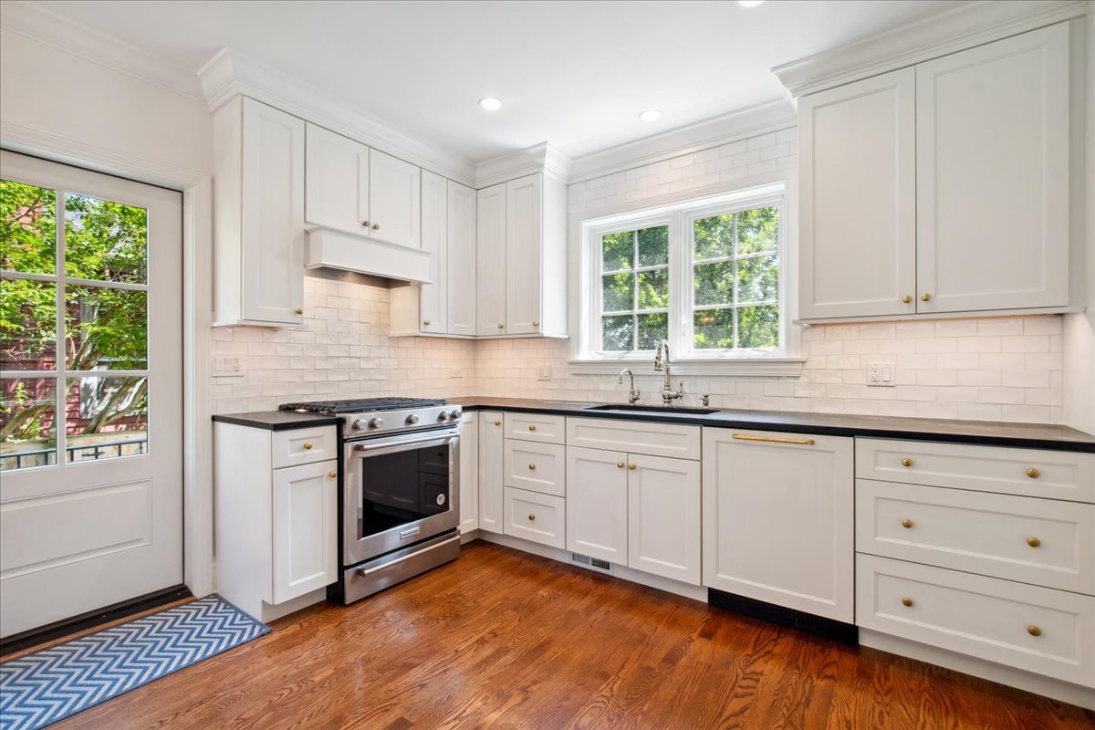 2429 Prospect Avenue Evanston, IL 60201 - Photo 9 of 31 a kitchen with granite countertop white cabinets and window