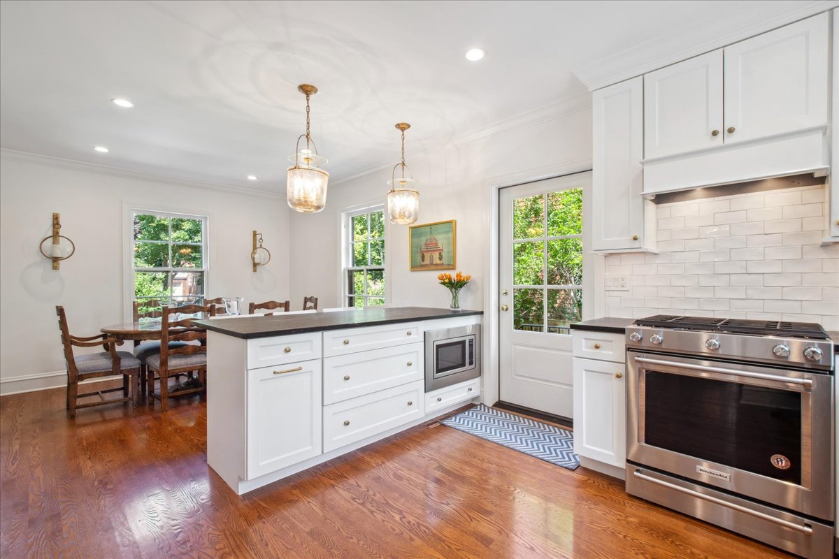 2429 Prospect Avenue Evanston, IL 60201 - Photo 10 of 31 a kitchen with white cabinets stove and sink