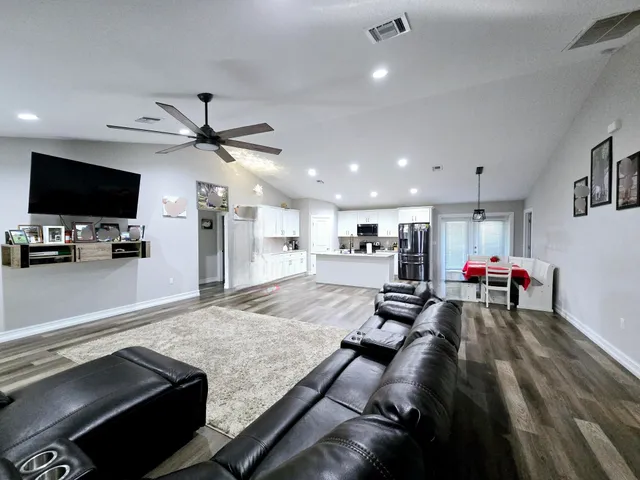 a view of a living room and a flat screen tv