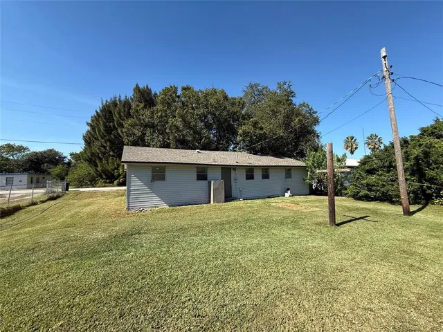 a house view with a backyard space