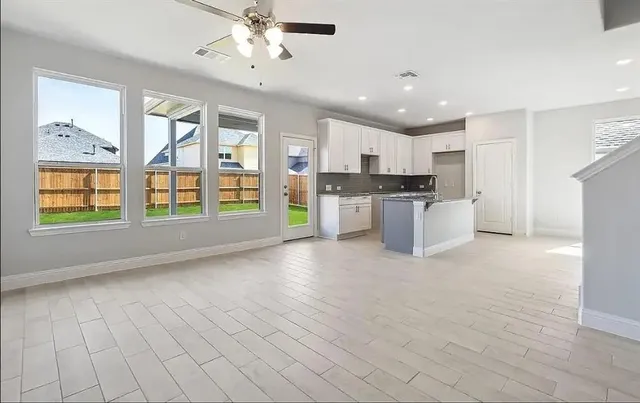 a view of a kitchen with a stove cabinets and a kitchen
