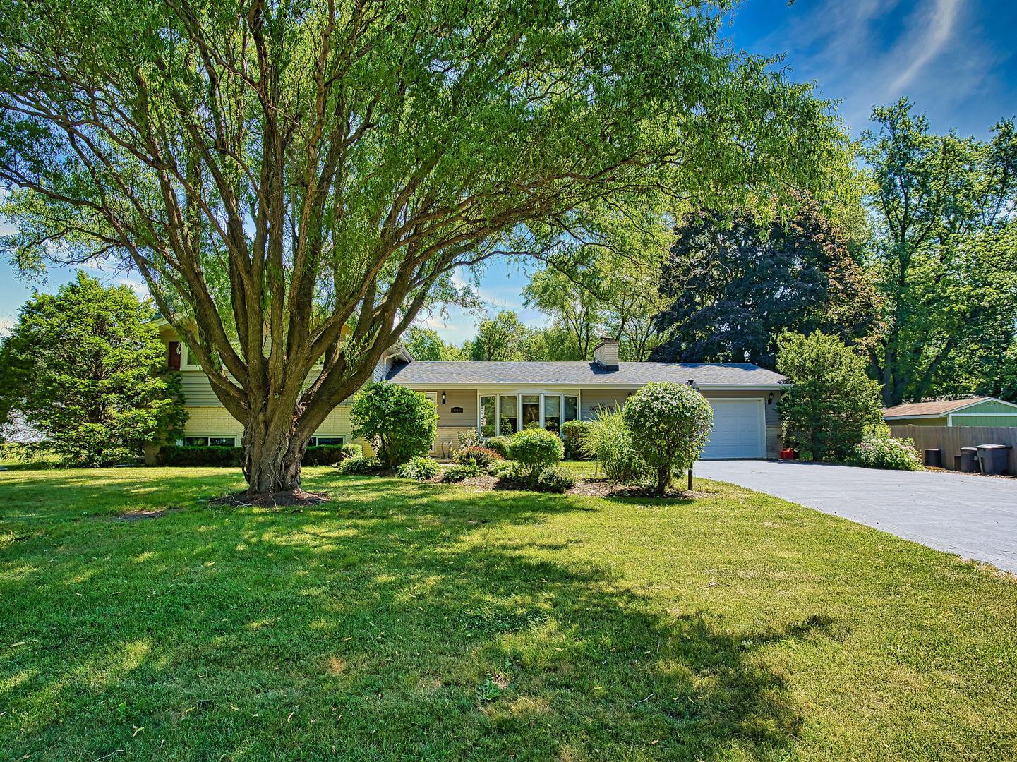 N647 Peter Road Wheaton, IL 60187 - Photo 1 of 1 a view of a house with backyard and sitting area
