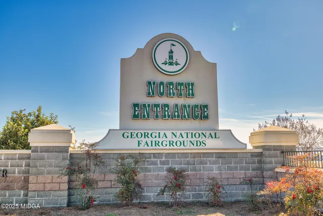 a sign on a brick wall