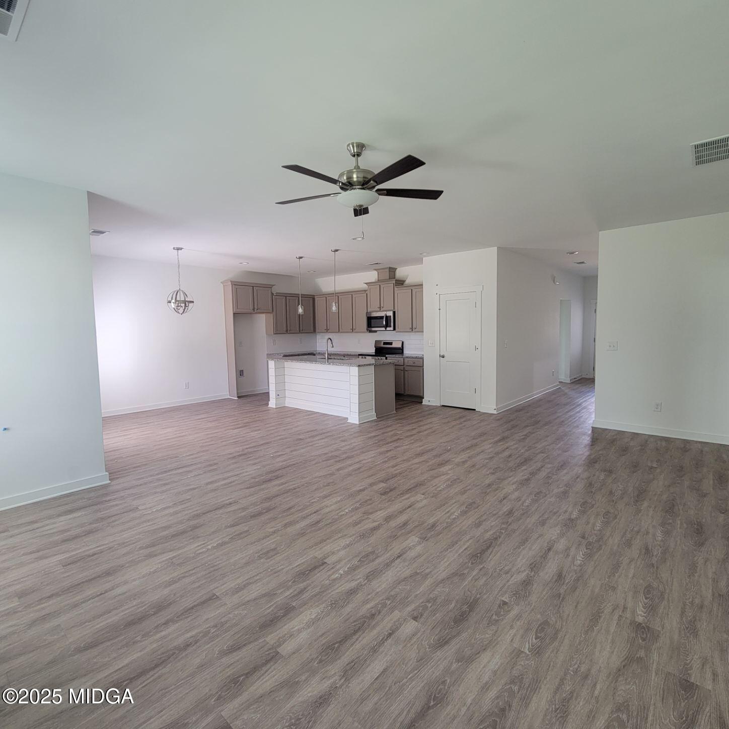 118 Bramblewood Way Perry, GA 31069 - Photo 5 of 27 a view of a kitchen with a sink and a refrigerator
