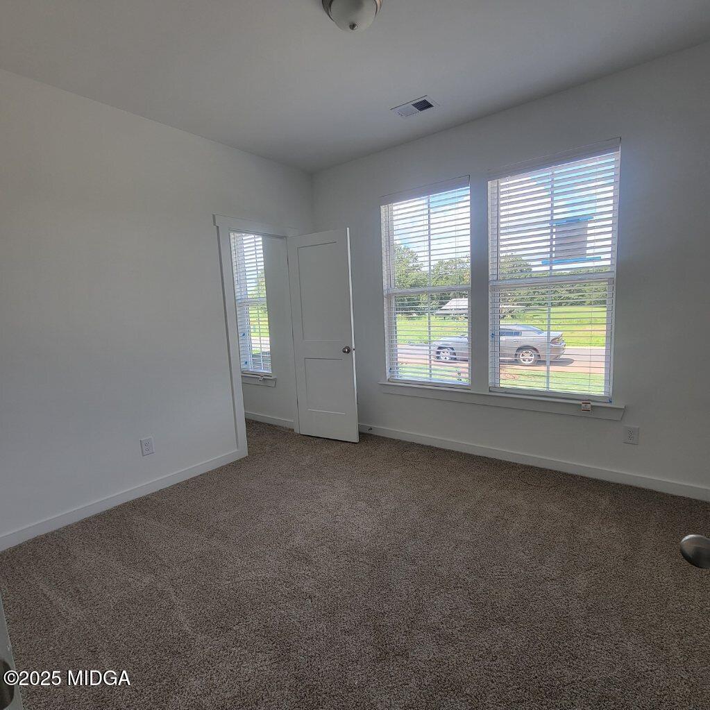 118 Bramblewood Way Perry, GA 31069 - Photo 7 of 27 an empty room with windows