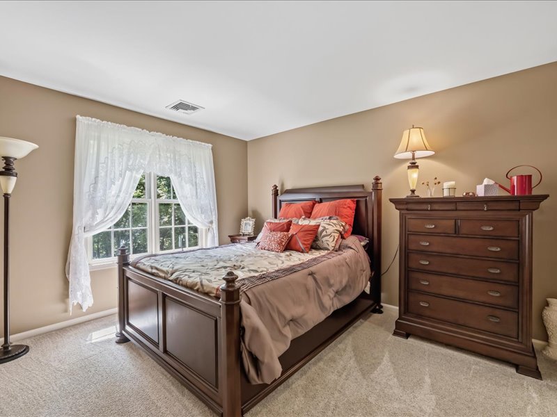 1168 Mt Pleasant Road Bangor, PA 18013 - Photo 72 of 100 Natural light pours through a multi-paned window onto the neutral carpeted floor.