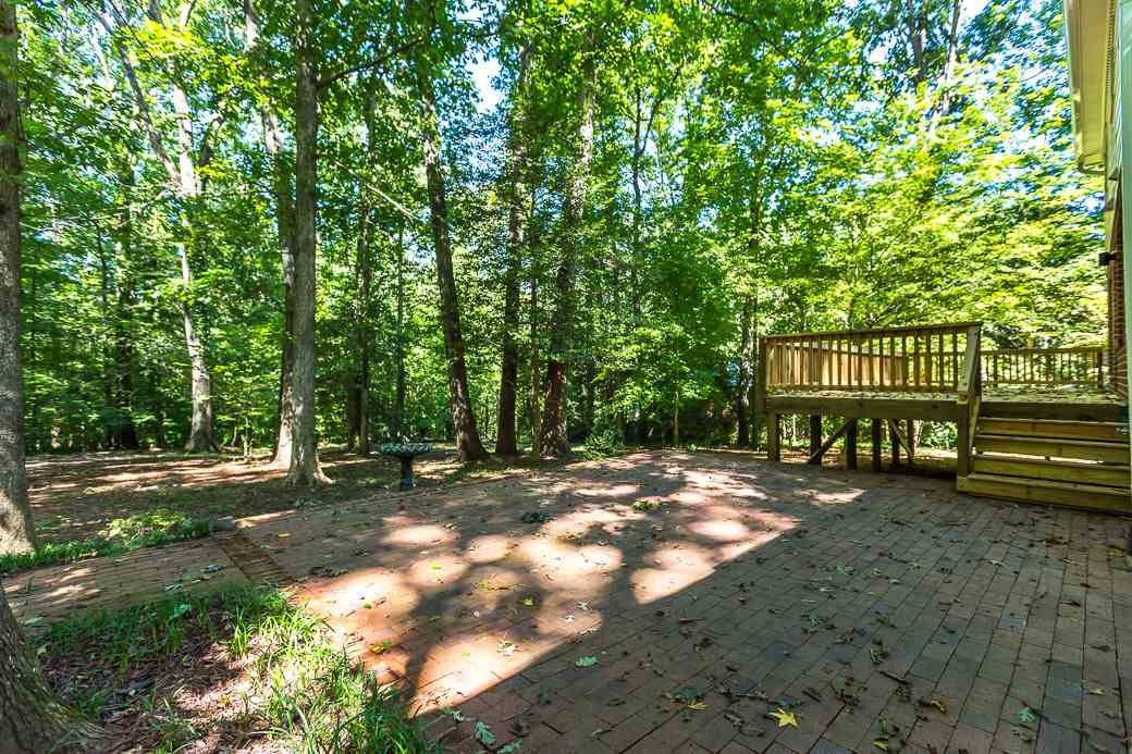 5508 Dutchman Drive Raleigh, NC 27606 - Photo 11 of 15 The Brick patio expands the area for entertaining, grilling & just being able to relax and enjoy the outdoors. Brick Patio