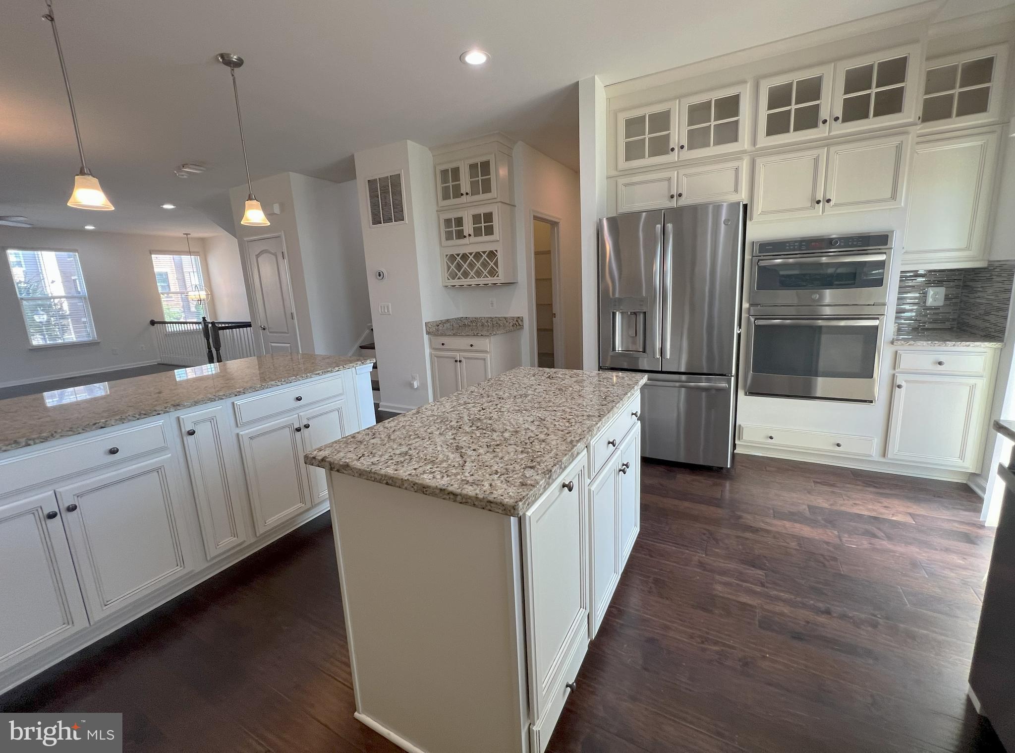 3092 Alan Shepard Street Herndon, VA 20171 - Photo 14 of 45 an open kitchen with a sink and refrigerator