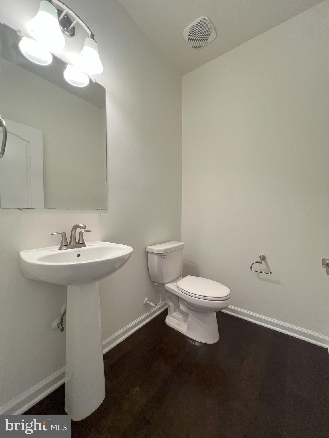 3092 Alan Shepard Street Herndon, VA 20171 - Photo 18 of 45 a bathroom with a sink a toilet and a mirror