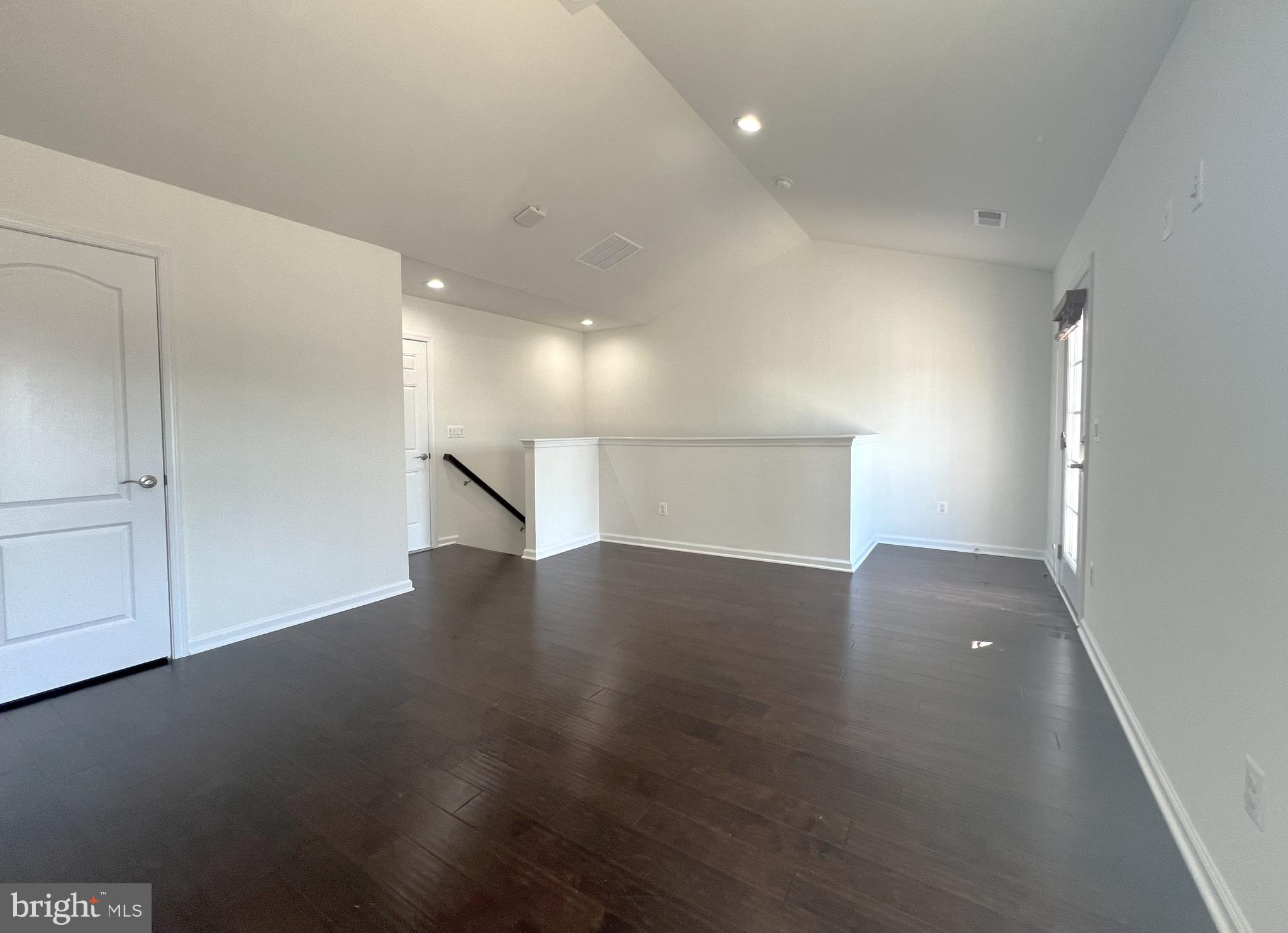 3092 Alan Shepard Street Herndon, VA 20171 - Photo 31 of 45 an empty room with wooden floor and a window