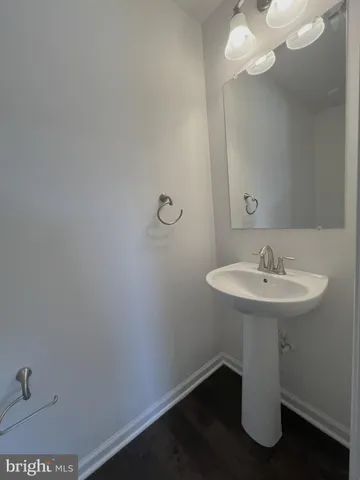 a bathroom with a sink a mirror and vanity