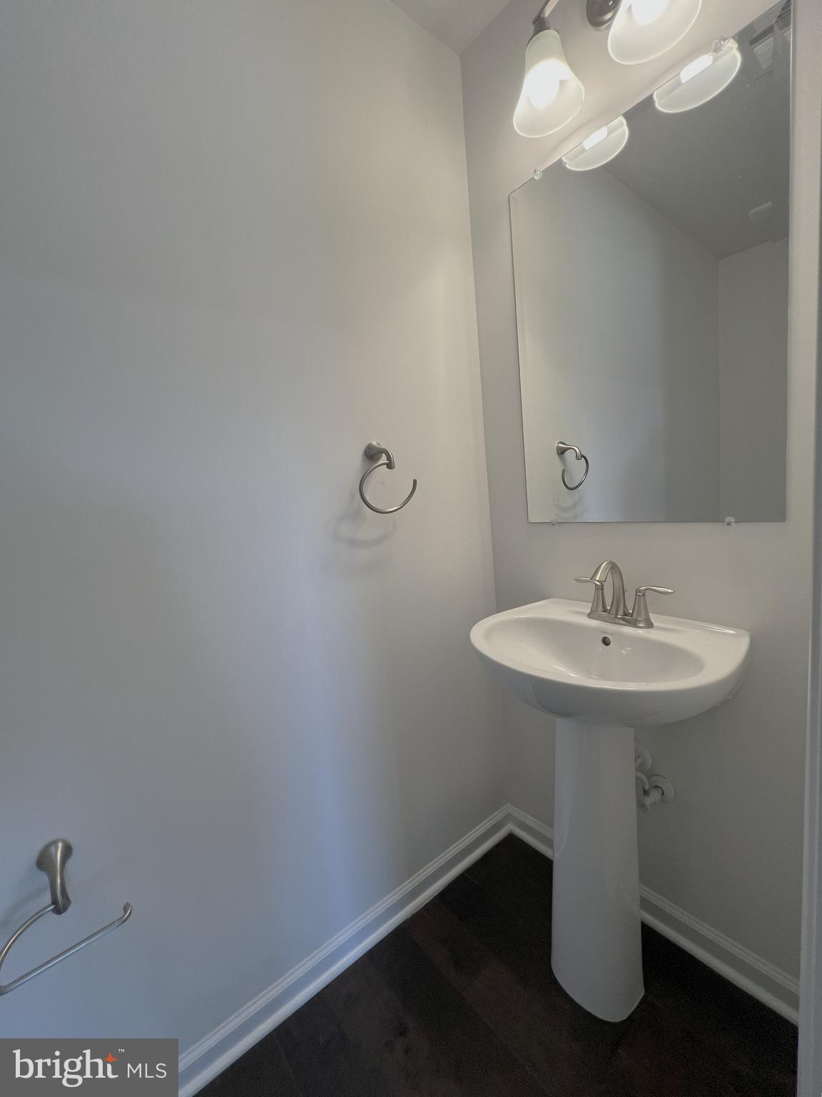 3092 Alan Shepard Street Herndon, VA 20171 - Photo 35 of 45 a bathroom with a sink a mirror and vanity