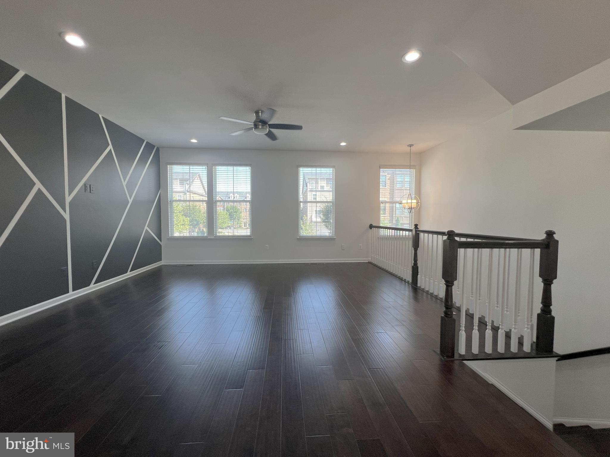 3092 Alan Shepard Street Herndon, VA 20171 - Photo 45 of 45 an empty room with wooden floor and windows