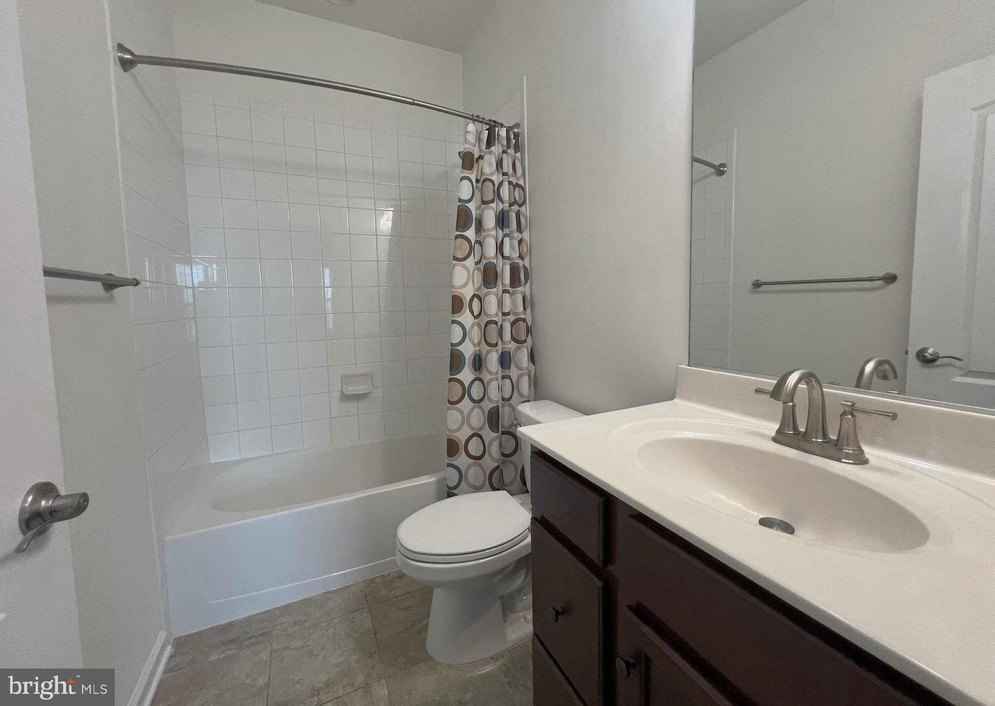 3092 Alan Shepard Street Herndon, VA 20171 - Photo 41 of 45 a bathroom with a sink a toilet and shower