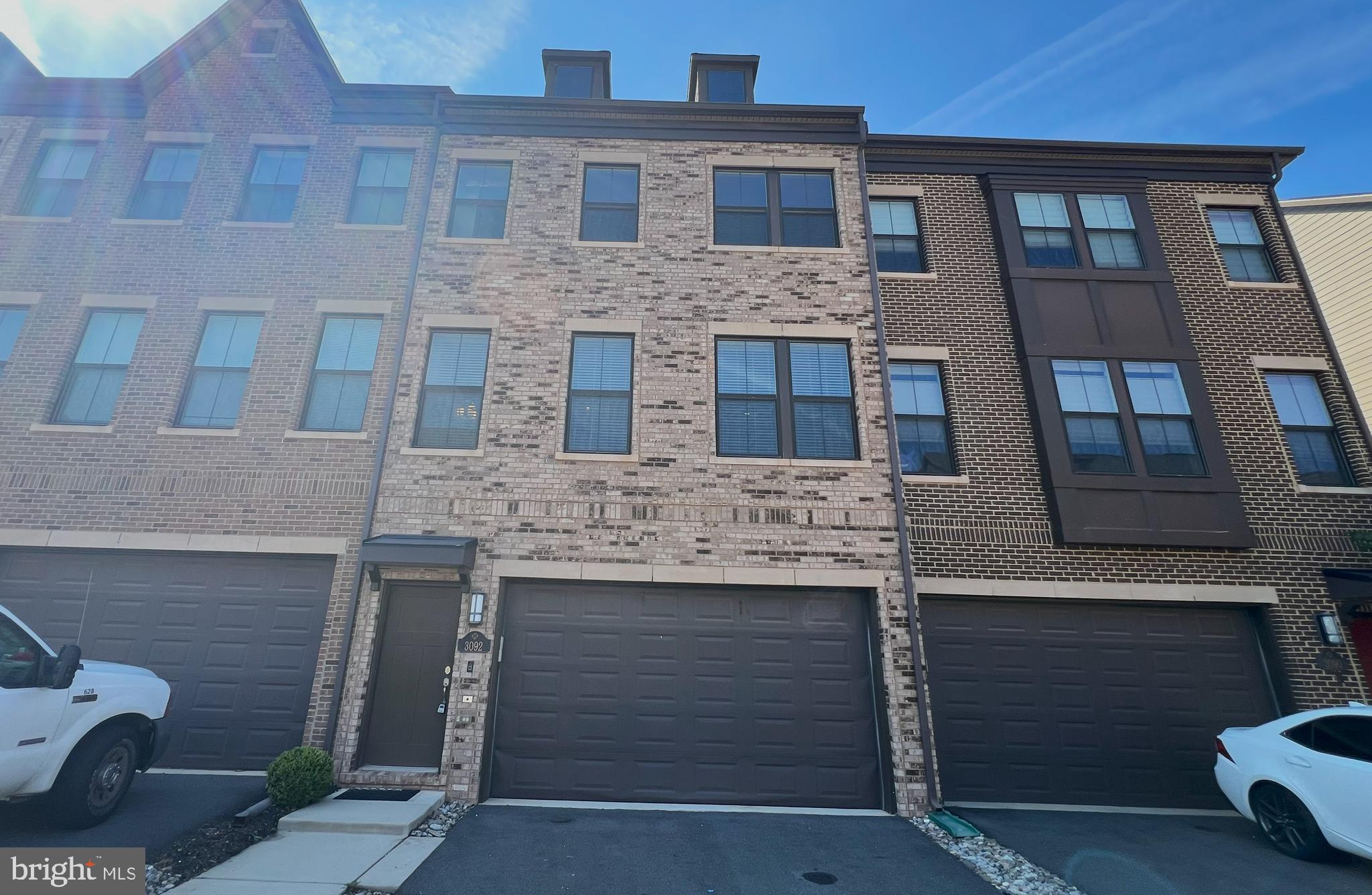 3092 Alan Shepard Street Herndon, VA 20171 - Photo 44 of 45 a front view of a house with a garage