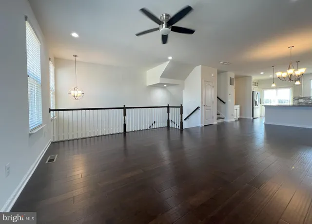 a view of a water heater room with a ceiling fan