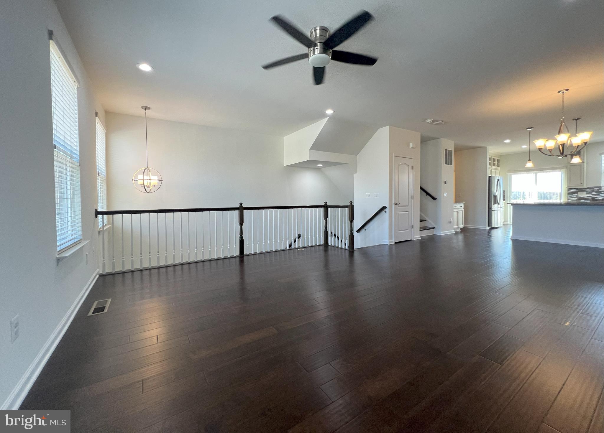 3092 Alan Shepard Street Herndon, VA 20171 - Photo 5 of 45 a view of a water heater room with a ceiling fan