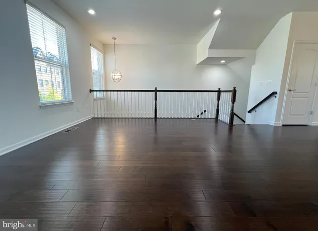 a view of an entryway with wooden floor