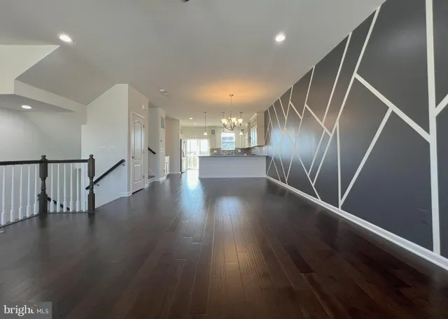 a view of gallery with wooden floor