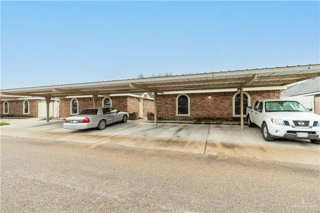 a view of a car parked in front of a house