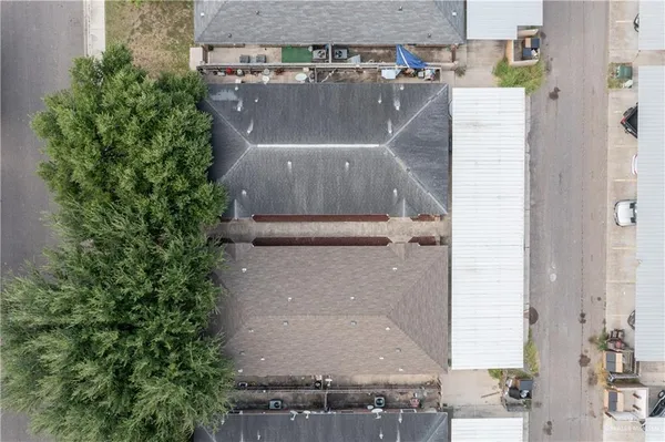 an aerial view of residential houses with outdoor space