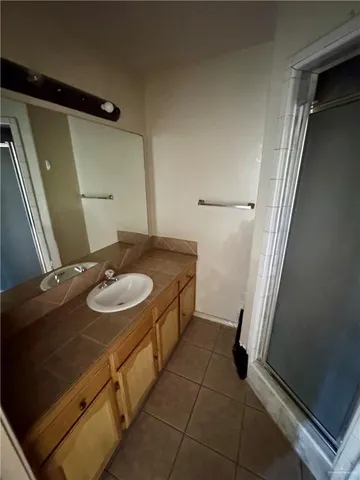 a bathroom with a sink and mirror