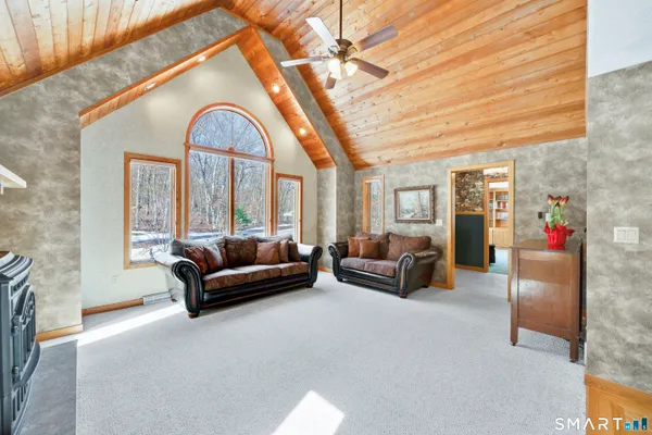 a large kitchen with stainless steel appliances granite countertop a stove and cabinets