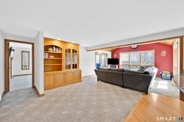 a living room with furniture and a large window