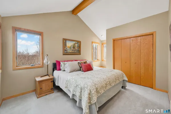 a bathroom with a sink vanity mirror and toilet