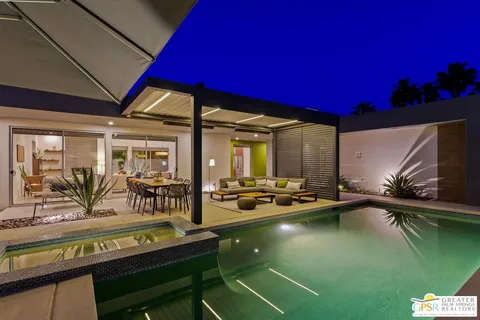a view of swimming pool with outdoor seating