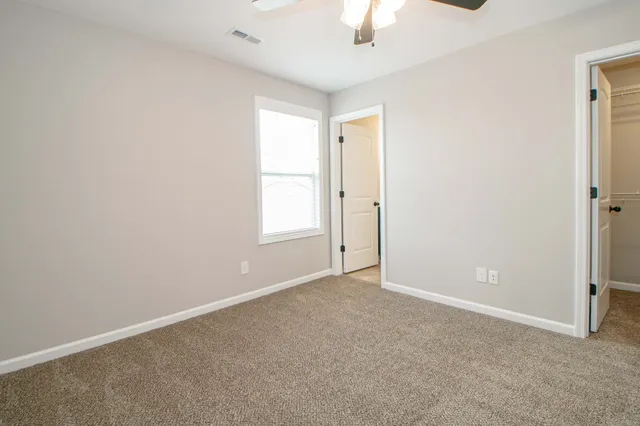 an empty room with a empty space and a window