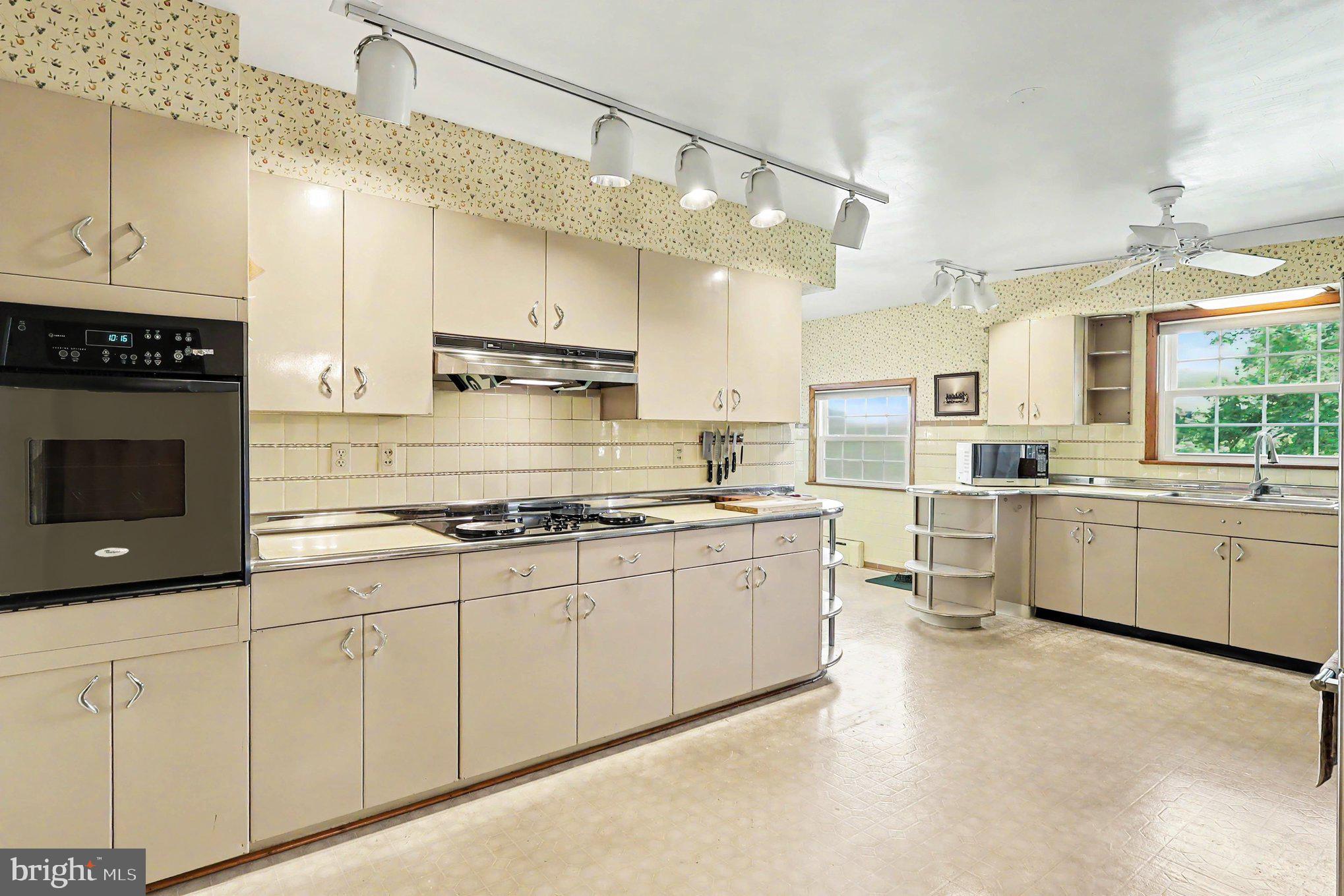 5 Eden Road Luray, VA 22835 - Photo 15 of 49 a kitchen with stainless steel appliances granite countertop a stove a sink and a refrigerator