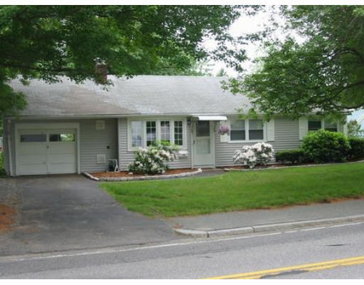 168 Potter Road Framingham, MA 01701 - Photo 1 of 1 a front view of a house with a garden and yard